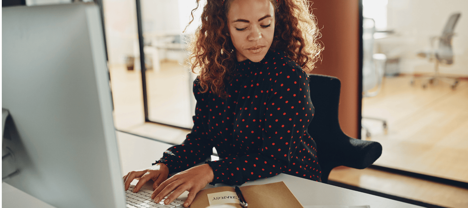 woman working at desk during the day