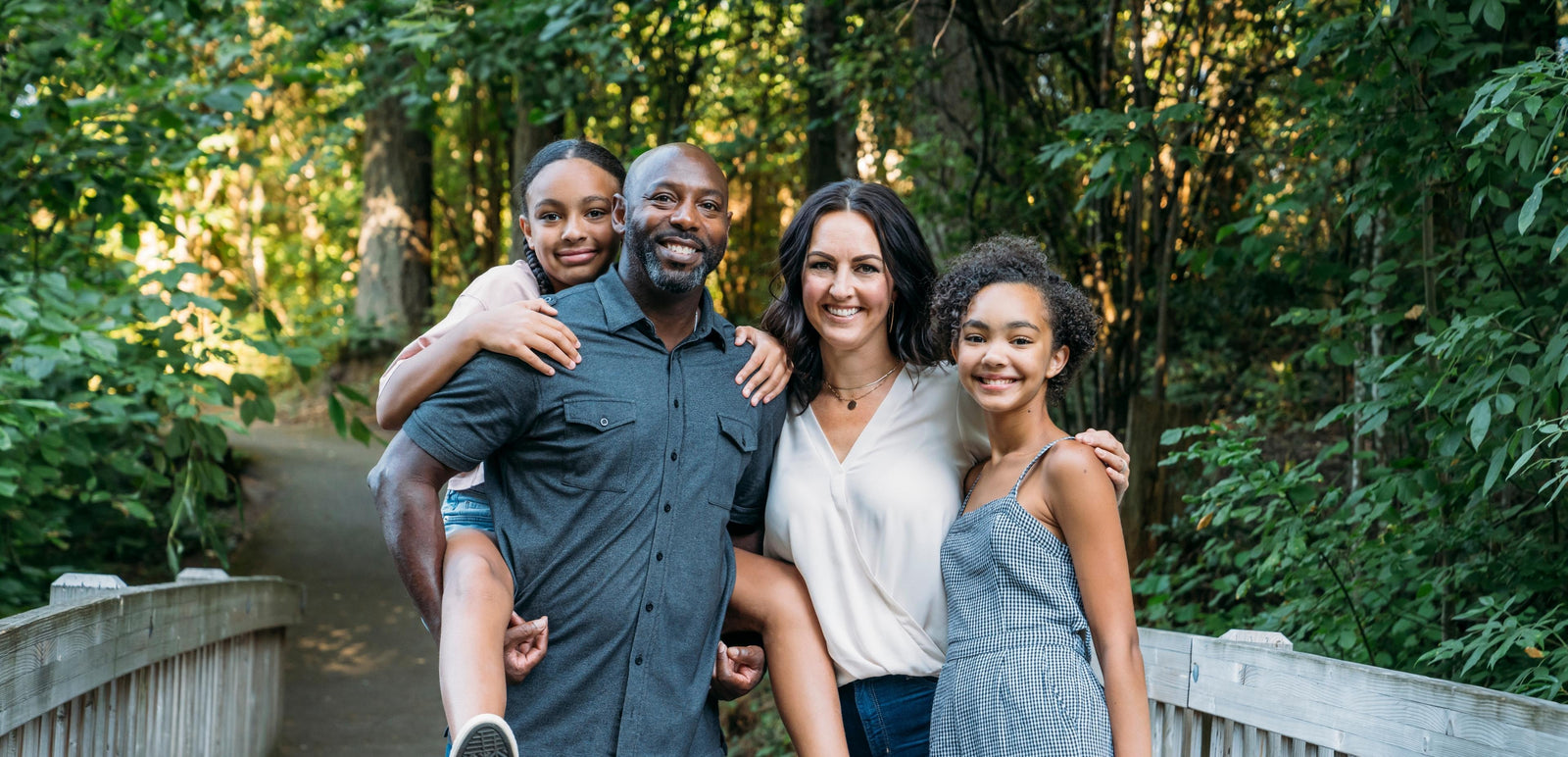 Family of four posing together after using simply breathe mouth tape