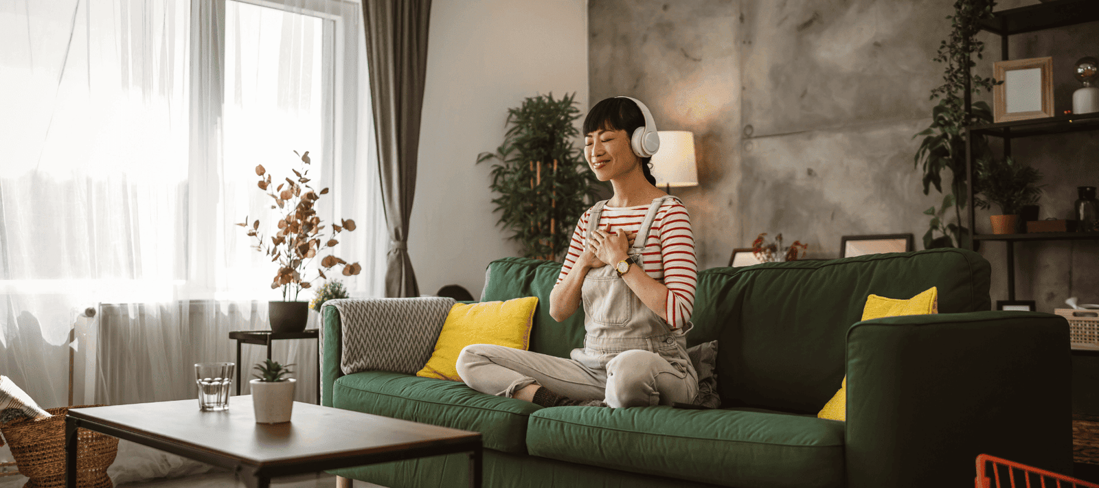 woman on couch meditating how to boost brain function