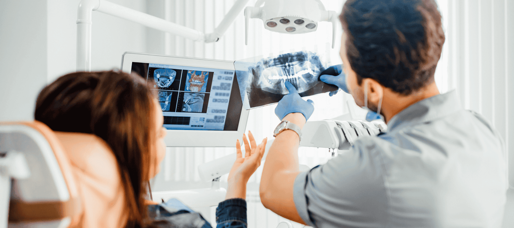 Dentist showing x-ray and whether mouth taping helps with teeth grinding