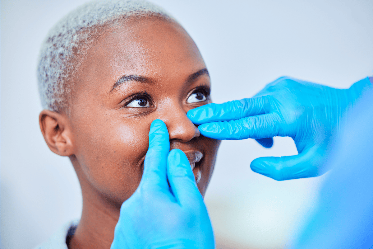 woman nose getting examined and what could be the benefits of mouth tape
