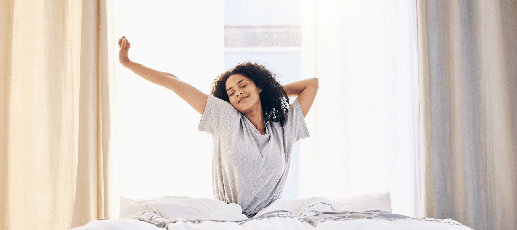 woman waking up from sleep fully rested